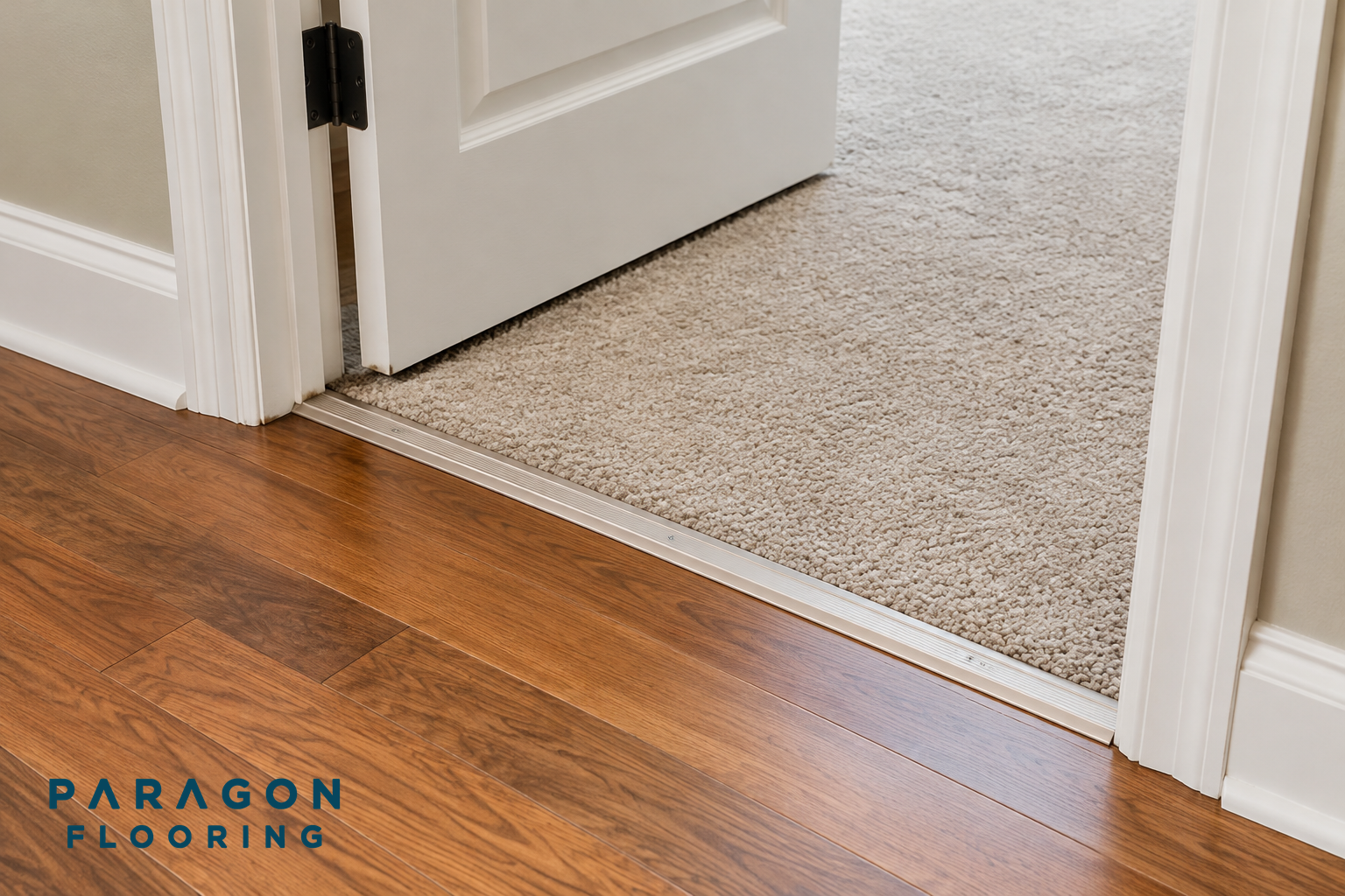 Doorway with two types of flooring meeting at the threshold, illustrating a clean transition strip.